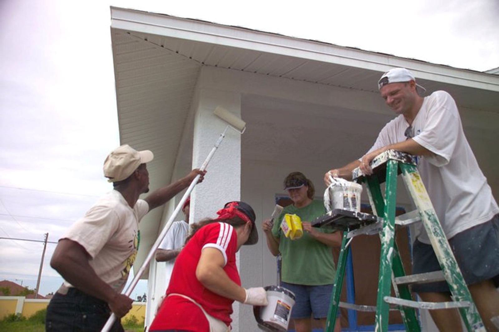 People working together to paint a home from the FNPH archive.